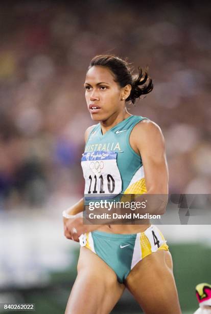 Cathy Freeman of Australia runs a second round heat of the Women's 400 meters event of the 2000 Summer Olympics track and field competition on...