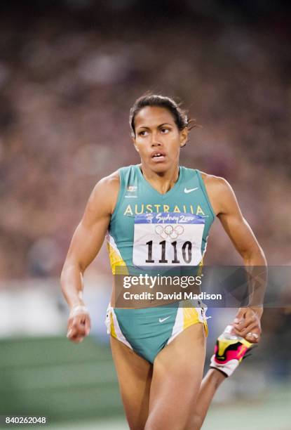 Cathy Freeman of Australia runs a second round heat of the Women's 400 meters event of the 2000 Summer Olympics track and field competition on...