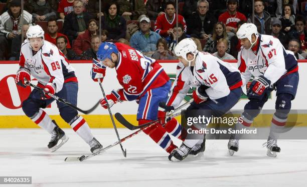 Steve Begin of the Montreal Canadiens battles for the puck as he is surrounded by Tyler Sloan#89, Donald Brashear and Boyd Gordon all of the...