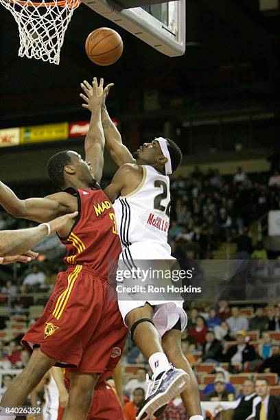 Taj McCullough of the Erie BayHawks shoots over Chris Hunter of the Fort Wayne Mad Ants at Tullio Arena on December 13, 2008 in Erie, Pennsylvania....