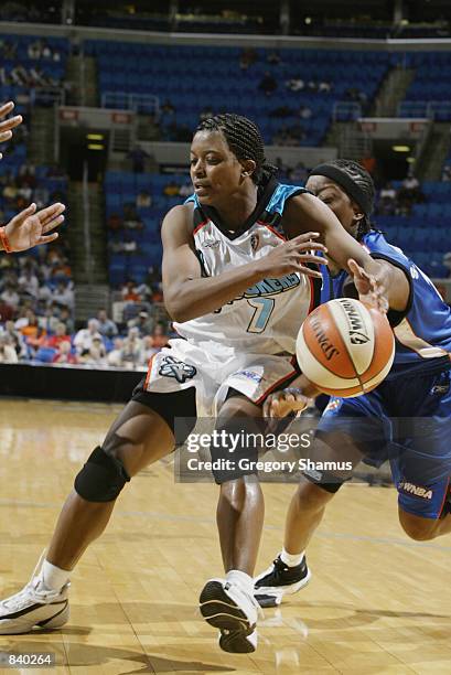 Brandi McCain of the Cleveland Rockers is defended by Shannon Johnson of the Orlando Miracle in the game on June 19, 2002 at Gund Arena in Cleveland,...