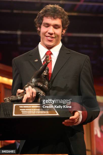 Quarterback Sam Bradford of the University of Oklahoma poses with the Heisman Trophy. Bradford was named the 74th Heisman Trophy winner on on...