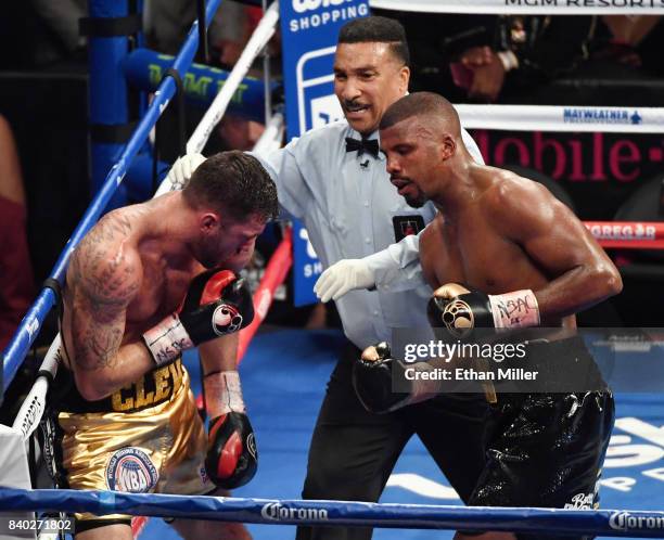 Referee Tony Weeks stops the WBA light heavyweight championship bout between Nathan Cleverly and Badou Jack in the fifth round of their WBA light...