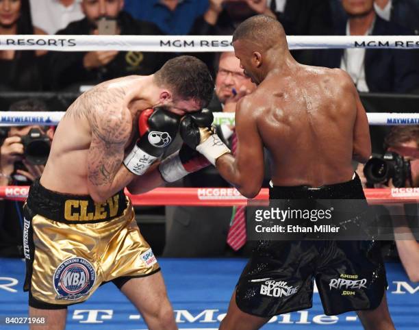 Badou Jack hits Nathan Cleverly with a left in the fourth round of their WBA light heavyweight championship bout at T-Mobile Arena on August 26, 2017...