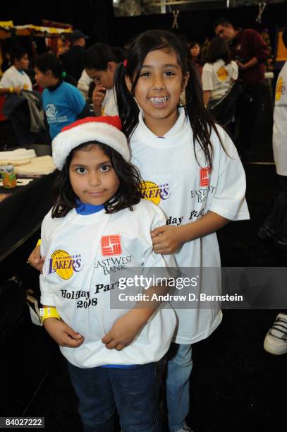 Participants pose for a photograph at the Los Angeles Lakers holiday party at Toyota Sports Center on December 13, 2008 in El Segundo, California....