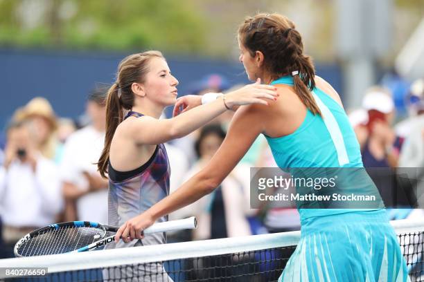 Annika Beck of Germany congratulates Julia Goerges of Germany on her victory after their first round Women's Singles match on Day One of the 2017 US...