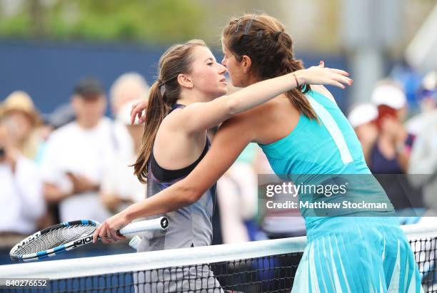 Annika Beck of Germany congratulates Julia Goerges of Germany on her victory after their first round Women's Singles match on Day One of the 2017 US...