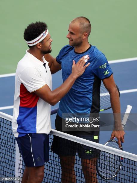 Jo-Wilfried Tsonga of France celebrates after winning his first round Men's Singles match against Marius Copil of Romania on Day One of the 2017 US...