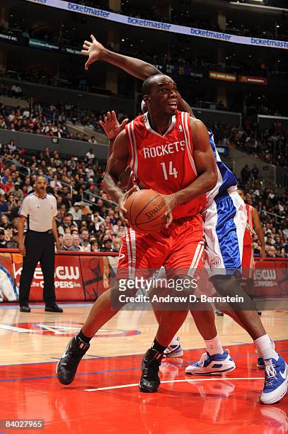 Carl Landry of the Houston Rockets handles the ball during the game against the Los Angeles Clippers at Staples Center on December 13, 2008 in Los...