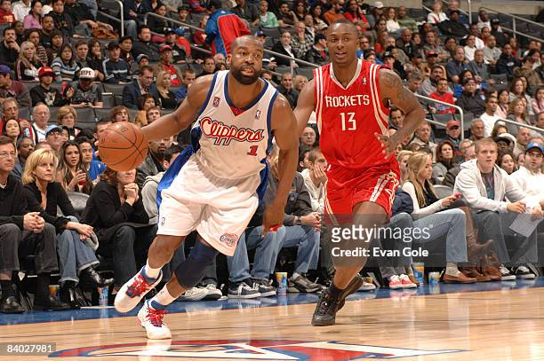 Baron Davis of the Los Angeles Clippers drives against Von Wafer of the Houston Rockets at Staples Center on December 13, 2008 in Los Angeles,...