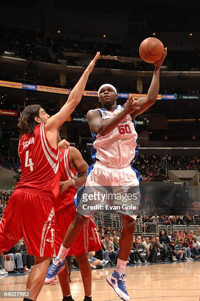 Zach Randolph of the Los Angeles Clippers puts up a shot against Luis Scola of the Houston Rockets at Staples Center on December 13, 2008 in Los...