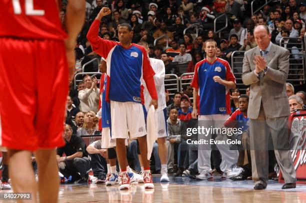 Marcus Camby and Head Coach Mike Dunleavy of the Los Angeles Clippers react from the sideline during their game against the Houston Rockets at...