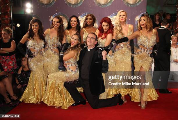 Reverend Richard Coles poses with female professional dancers at the 'Strictly Come Dancing 2017' red carpet launch at The Piazza on August 28, 2017...