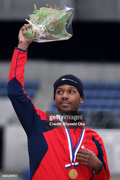 Gold medalist Shani Davis of the USA celebrates on the podium at the award ceremony after the Men's 1000m Division A during the Essent ISU World Cup...