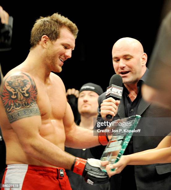 President Dana White awards Ryan Bader with the Ultimate Fighter trophy after defeating Vinicius Magalhaes at The Ultimate Fighter 8 Finale at The...