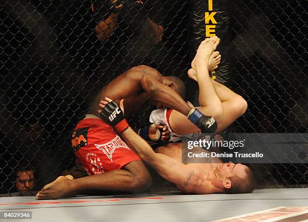 Anthony Johnson, red trunks and Kevin Burns fight in the Welterweight bout where Johnson won at UFC Fight Night at The Pearl in The Palms Hotel and...