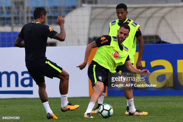 Brazil's team players Paulinho and Renato Augusto take part in training session at the Gremio team training centre in Porto Alegre, Brazil on August...