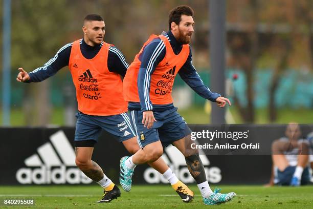 Lionel Messi and Mauro Icardi of Argentina look on during a training session at 'Julio Humberto Grondona' training camp on August 28, 2017 in Ezeiza,...