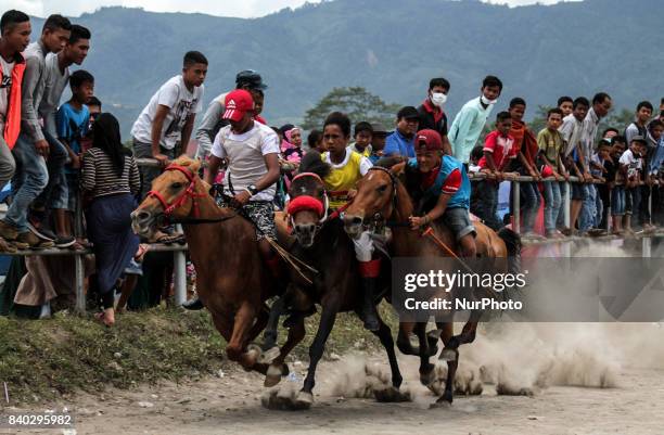 Acehnese child jockey compete during traditional horse race in Takengon on August 27, 2017 in Aceh Province, Indonesia. The traditional horse racing...