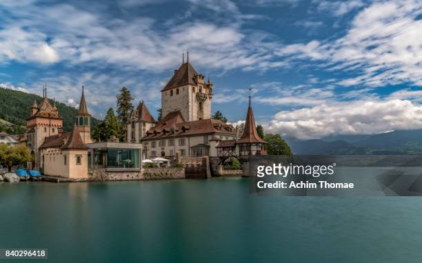 lake thunersee, canton bern, switzerland, europe - oberhoffen castle stock pictures, royalty-free photos & images