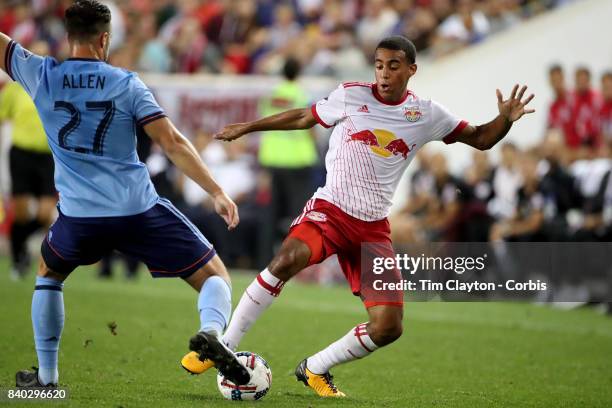 Tyler Adams of New York Red Bulls challenged by RJ Allen of New York City FC during the New York Red Bulls Vs New York City FC MLS regular season...