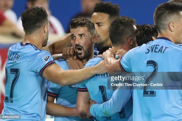 David Villa of New York City FC celebrates with goal scorer Maximiliano Moralez of New York City FC and team mates RJ Allen of New York City FC...