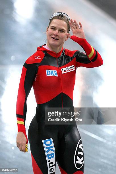 Jenny Wolf of Germany waves to audience after competing in the Ladies 100m final during the Essent ISU World Cup Speed Skating Nagano at the Nagano...