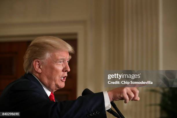 President Donald Trump compliments One America News Network during a joint news conference with Finnish President Sauli Niinisto in the East Room of...