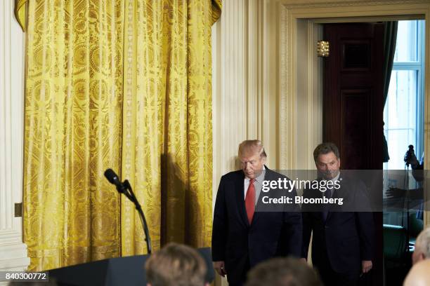 President Donald Trump, left, and Sauli Niinisto, Finland's president, arrive for a joint press conference at the White House in Washington, D.C.,...