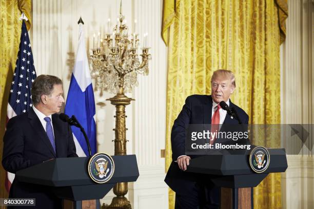 President Donald Trump, right, speaks as Sauli Niinisto, Finland's president, listens during a joint press conference at the White House in...