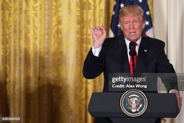 President Donald Trump speaks during a joint news conference with President Sauli Niinisto of Finland at the East Room of the White House August 28,...