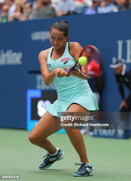 Viktoria Kuzmova of Slovakia returns a shot during her first round Women's Singles match against Venus Williams of the United States on Day One of...