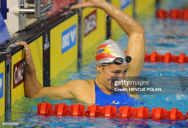 Mireia Belmonte Garcia of Spain celebrates after winning the women's 400m individual medley race setting a new world record with a time of 4 min 25...