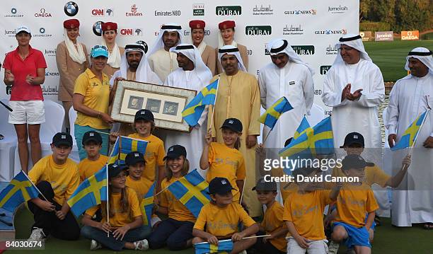 Annika Sorentam of Sweden is presented with a special gift to commemorate her retirement from competitive golf in the city of Dubai by Mohamed Juma...