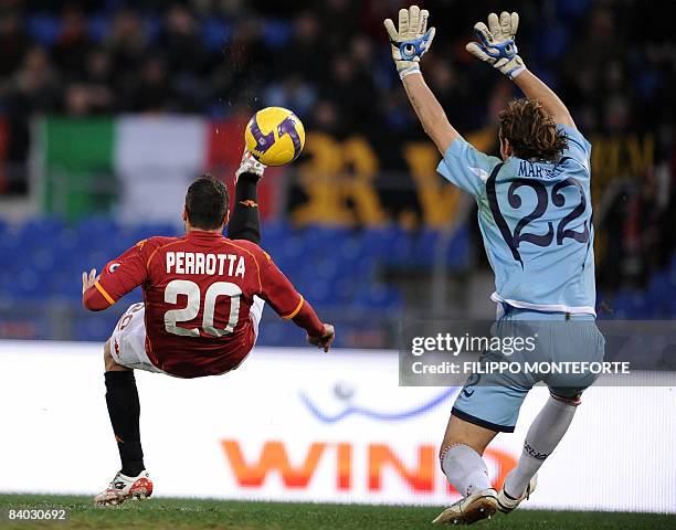 Roma's midfielder Simone Perrotta shoots to score against Cagliari's goalkeeper Frederico Marchetti during their Italian Serie A football match at...