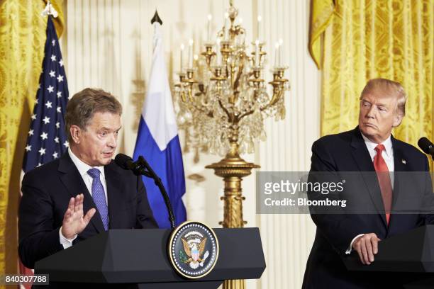 Sauli Niinisto, Finland's president, speaks as U.S. President Donald Trump, right, listens during a joint press conference at the White House in...