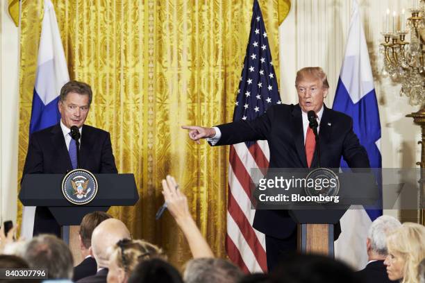 President Donald Trump, right, speaks as Sauli Niinisto, Finland's president, listens during a joint press conference at the White House in...