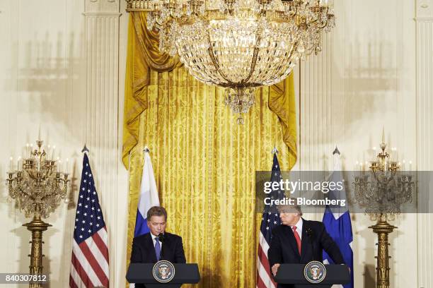 Sauli Niinisto, Finland's president, speaks as U.S. President Donald Trump, right, listens during a joint press conference at the White House in...