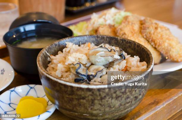 kaki meshi teishoku (set menu featuring steamed oysters on rice) - takuan stock-fotos und bilder