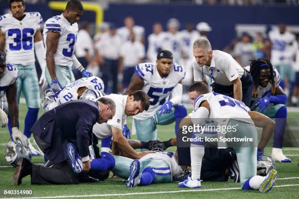Dallas Cowboys medical personnelle check on Dallas Cowboys linebacker Anthony Hitchens during the NFL preseason game between the Dallas Cowboys and...