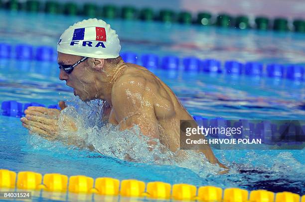 Hugues Duboscq of France swims to win men's 200m breaststroke race and setting the European record with time 2.04.59. During the European Short...