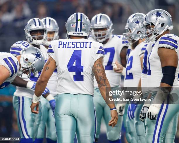 Dallas Cowboys quarterback Dak Prescott calls a play in the huddle during the NFL preseason game between the Dallas Cowboys and Oakland Raiders on...