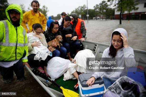 Rising flood waters stranded hundreds of residents of Twin Oaks Village in Clodine, where an collection of small boat owners coordinated to bring...