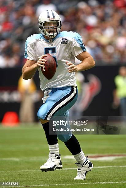 Quarterback Kerry Collins of the Tennessee Titans rolls out with the ball against the Houston Texans on December 14, 2008 at Reliant Stadium in...