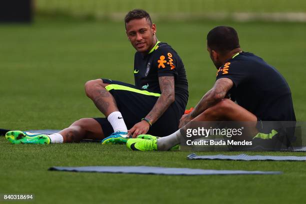 Neymar and Daniel Alves take part in a training session at the Gremio team training centre on August 28, 2017 in Porto Alegre, Brazil, ahead of their...
