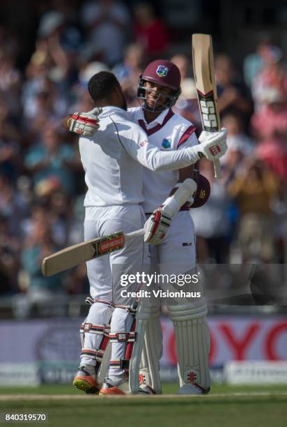 Kraigg Brathwaite of West Indies congratulates his team mate Shai Hope after his century during the second day of the second test between England and...