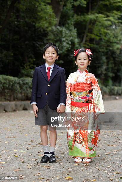 boy and girl standing for shichi-go-san ceremony,p - shichi go san stock pictures, royalty-free photos & images