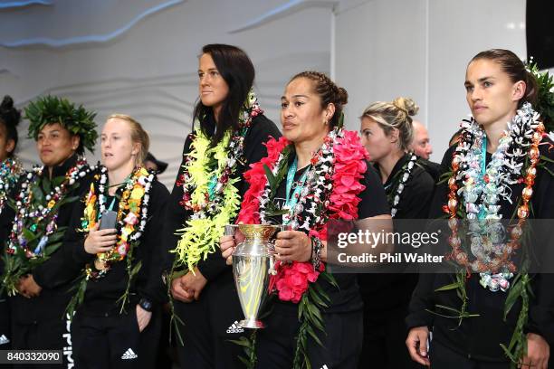 Black Ferns captain Fiao'o Faamausili holds the trophy as the New Zealand Black Ferns are welcomed home at Auckland International Airport on August...