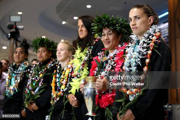Black Ferns captain Fiao'o Faamausili holds the trophy as the New Zealand Black Ferns are welcomed home at Auckland International Airport on August...