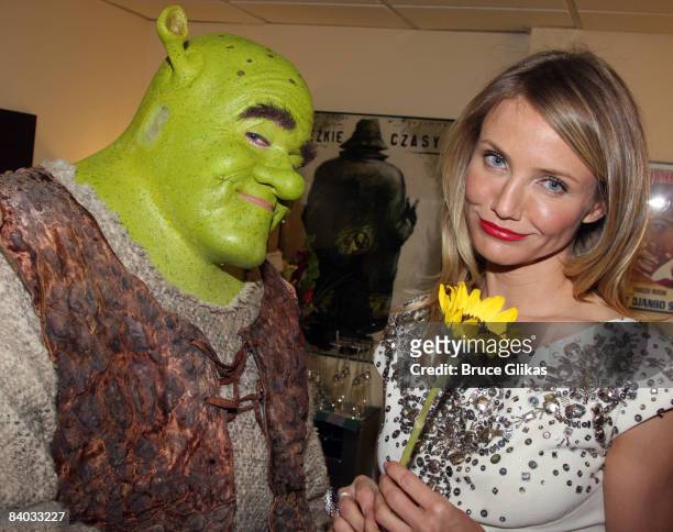 Cameron Diaz visits Brian d'Arcy James as "Shrek" backstage on opening night of "Shrek The Musical" on Broadway at the Broadway Theatre on December...